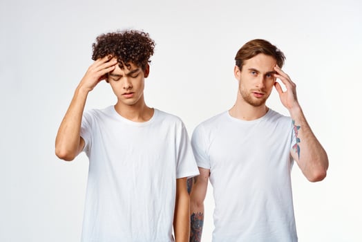 two guys in white t-shirts communication friendship light background photo