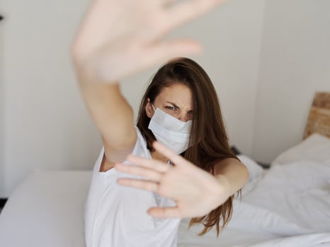 woman in medical mask gesturing with her hands aggression irritability pandemic coronavirus photo