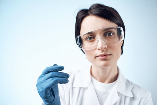 Woman laboratory assistants in white coat winter gloves research test biology photo