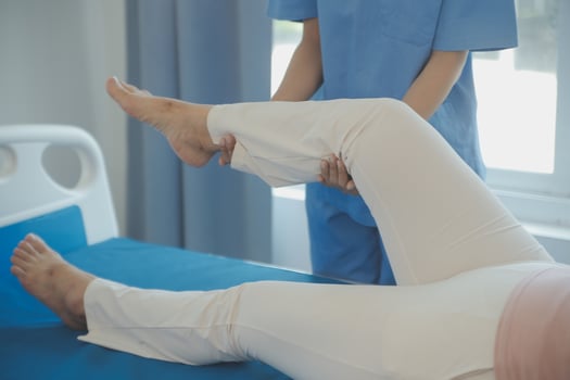 Patient doing some special exercises under supervision in a room photo