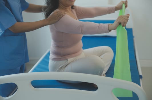 Patient doing some special exercises under supervision in a room photo