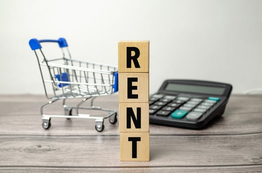 Hand Placing House Icon Wooden Block Beside Rent Word Blocks photo