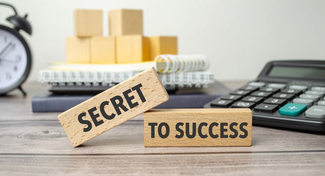 secret to success on the work table and alarm clock photo
