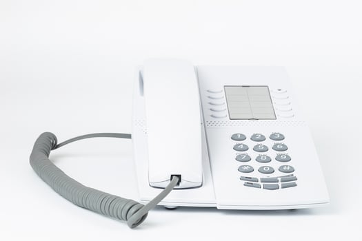 White office desk phone isolated on white photo