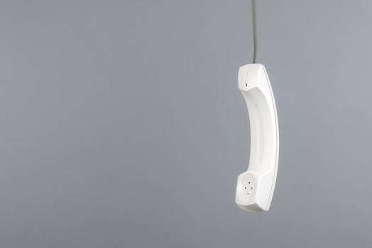White telephone receiver with copy space photo