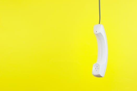 White telephone receiver with copy space photo