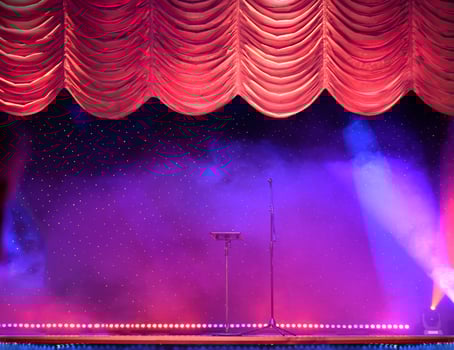Elegant theater stage with the red curtains opening photo