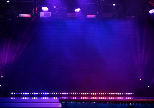 Elegant theater stage with purple lights and smoke photo