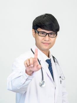 Asian man student scientist or doctor one person, wearing a white gown, standing, looking and smiling, white background with a stethoscope auscultating the heart around his neck. photo