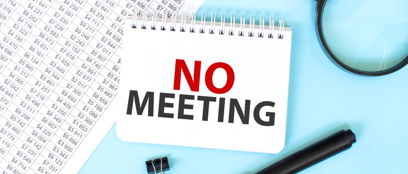 White notepad and magnifier on the financial documentation. Text no meeting. Business concept photo