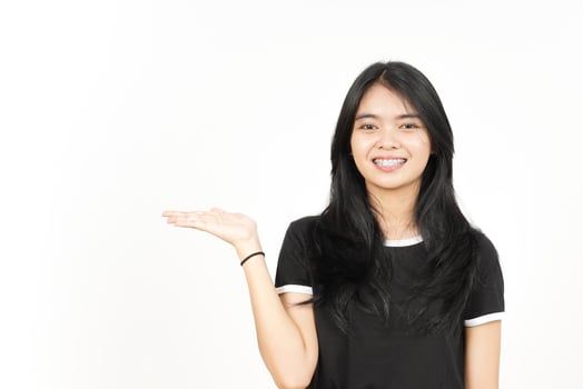Showing and Presenting Product on Open Palm Of Beautiful Asian Woman Isolated On White Background photo