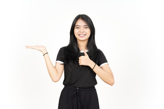 Showing and Presenting Product on Open Palm with Thumbs up Of Beautiful Asian Woman Isolated photo