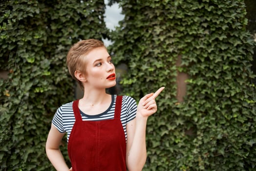 woman with short hair walking in the park a cup of coffee summer lifestyle photo