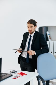 man in a suit holding a phone telephone office executive photo
