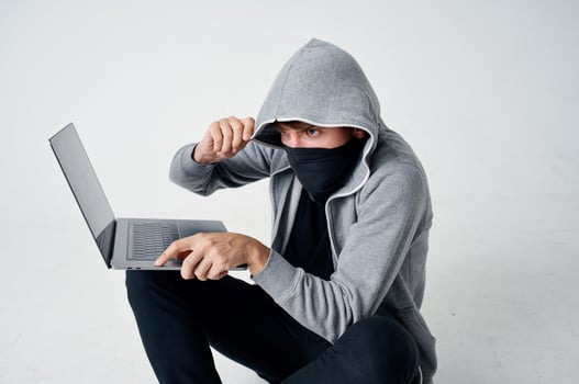 male thief hooded head hacking technology security isolated background photo