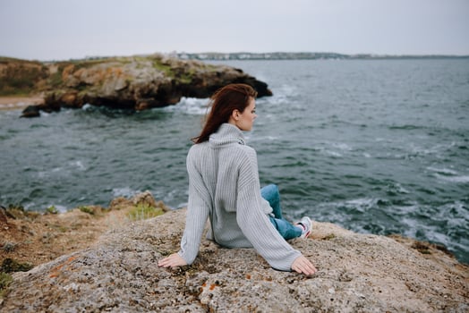 woman sweaters cloudy sea admiring nature Lifestyle photo
