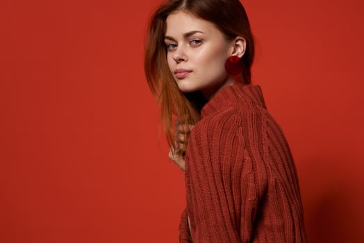 cheerful woman in red sweater earrings charm cosmetics model photo