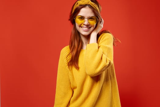 cheerful woman in yellow glasses hipster fashion posing lifestyle photo