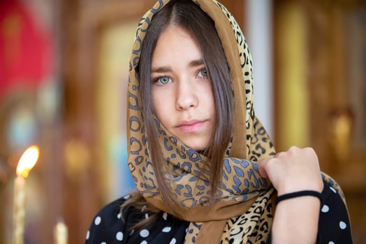 July 15, 2020 Belarus, city of Gomil. City church. Beautiful girl in a headscarf on a church background. photo