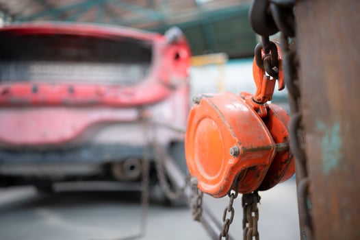 The car crashed so hard that the car body collapsed into distortion. A car body puller is required to restore the car body to its original shape. photo