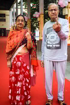 New Delhi, India - March 04 2023 - Unidentified people showing their ink-marked fingers after casting votes in front of polling booth of east Delhi area for MCD local body Elections 2022 photo