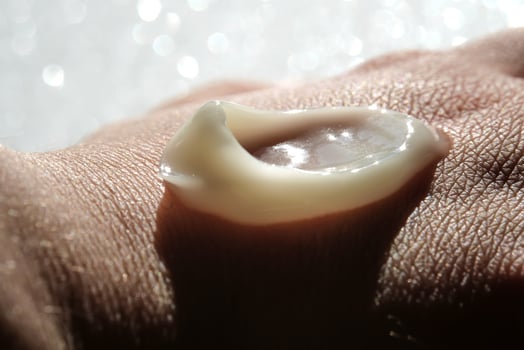 A smear of moisturizer on the hand. photo