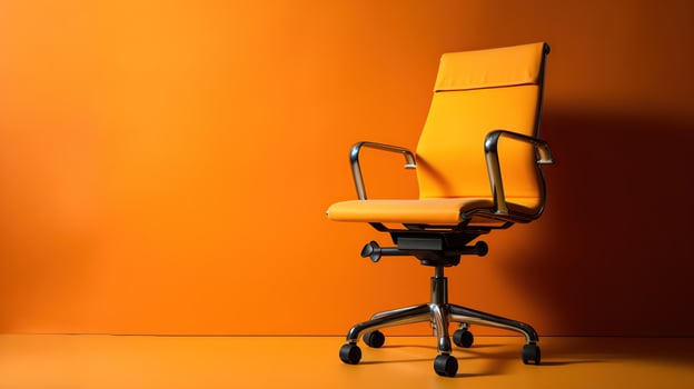 Orange office chair on yellow background, photo