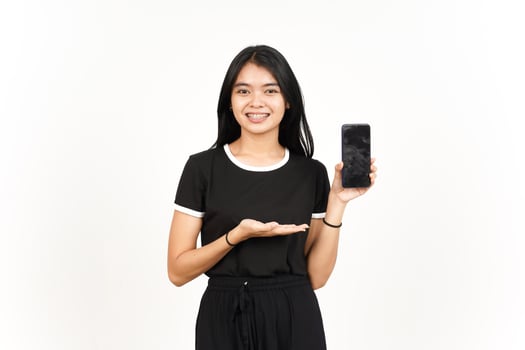 Smile and Showing Apps or Ads On Blank Screen Smartphone Of Beautiful Asian Woman Isolated On White photo