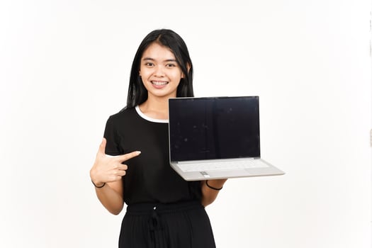 Showing and Presentation laptop blank screen Of Beautiful Asian Woman Isolated On White Background photo