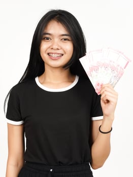 Holding 100000 Rupiah Banknote of Beautiful Asian Woman Isolated On White Background photo