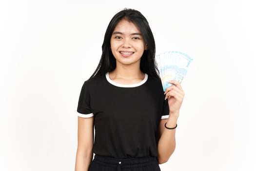 Holding 50000 Rupiah Banknote of Beautiful Asian Woman Isolated On White Background photo