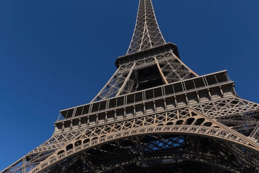 central part of Eiffel Tower against blue sky photo