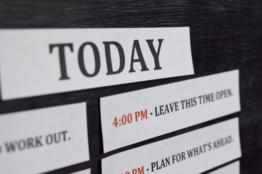 Close up making agenda Daily schedule on personal organizer. Business and entrepreneur concept. Isolated on black background photo