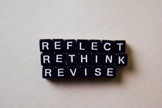 Reflect - Rethink - Revise on wooden blocks. Business and inspiration concept photo