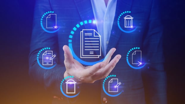 Businessman holding multimedia type of modern buttons with virtual background, Document Management System DMS, searching and managing corporate files information. photo