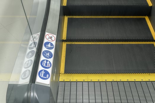 Signs on an escalator, warning signs photo