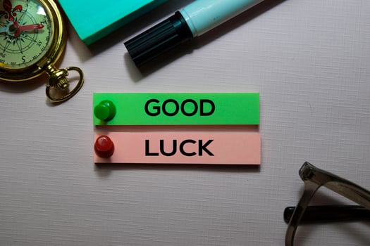 Good Luck text on sticky notes isolated on office desk photo