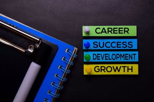 Career, Success, Development, Growth text on sticky notes isolated on Black desk. Mechanism Strategy Concept photo