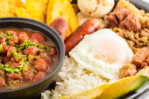 Traditional Colombian dish called Banda paisa a plate typical of Medellin that includes meat, beans, egg and plantain photo