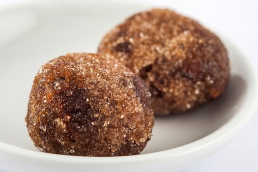 Tamarind balls a traditional sweet from Cartagena de indias  on white ceramic dish photo