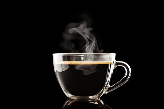 Close up a cup of a black hot coffee with smoke on black background. photo