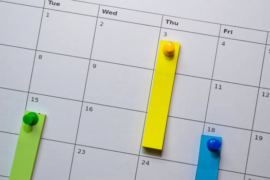 Close up stiky notes on a calendar. Schedule or plan concept photo