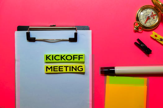 Kickoff Meeting write on sticky notes isolated on Pink background. photo