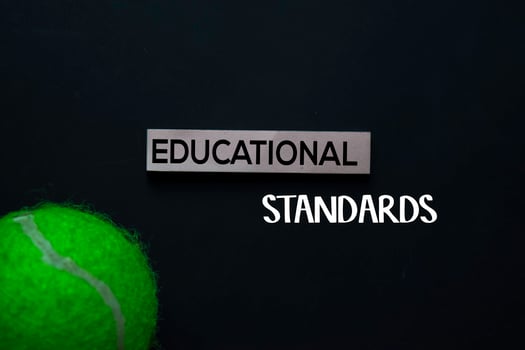 Educational Standards text on sticky notes. Office desk background. photo