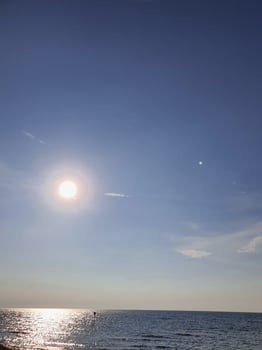 The sun is dim in the afternoon over the Java Sea photo