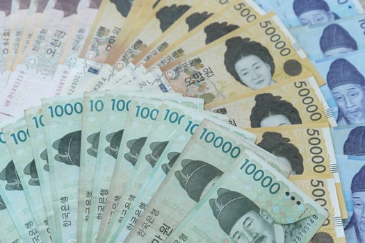 currency of Korea which is used to represent value in exchange and the won is the main currency of Korean people. Korean won notes for money concept background. photo