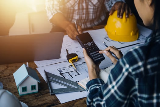 Construction and structure concept of Engineer or architect meeting for project working with partner and engineering tools on model building and blueprint in working site, contract for both companies. photo