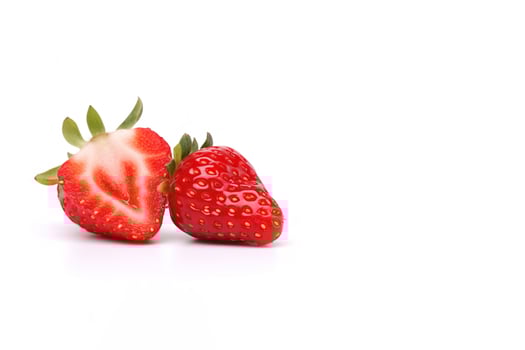 Fresh whole and sliced strawberries isolated on white background with copy space. photo