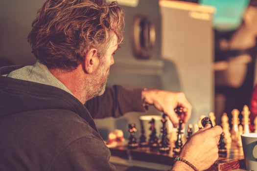Man Making His Move While Playing Chess photo