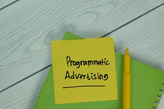 Programmatic Advertising text on sticky notes isolated on office desk photo
